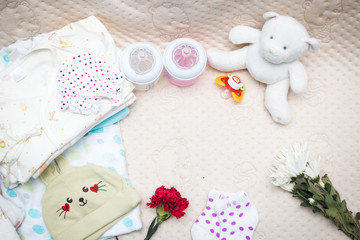 newborn baby clothes with bottle of milk for infant