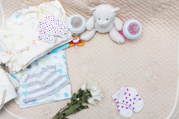 newborn baby clothes with bottle of milk for infant