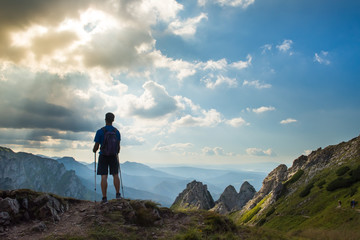 man hiker on top of mountain