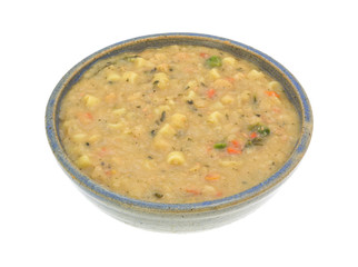 White bean soup in a bowl on a white background side view.
