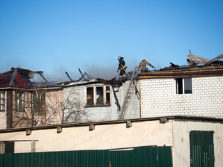 Fototapeta premium firefighters extinguish a fire