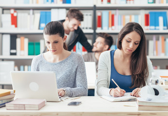 Young college students studying together