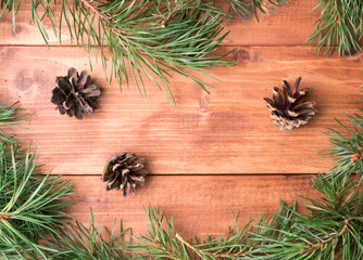 Christmas background with balls and decorations over wooden table