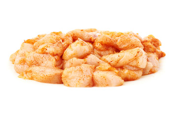 Raw chicken fillet cutted into pieces and spiced isolated over white background