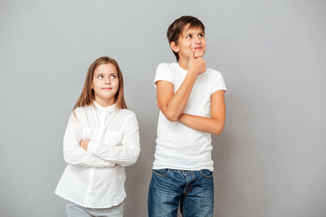 Cute thoughtful boy and girl thinking © Drobot Dean
