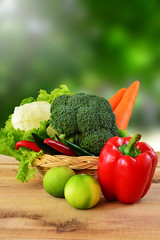 Vegetables on wooden and blur nature background.