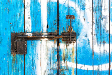 Rustic wooden door with metal lock