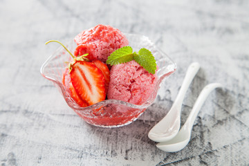 ice cream, red sorbet with strawberry on a concrete background, selective focus