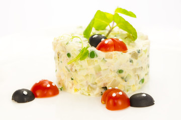 Olivier is decorated with tomatoes in the form of ladybirds
