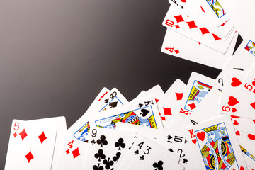 poker chips and cards on black background