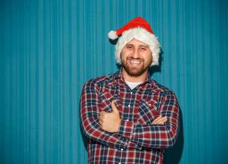 Smiling christmas man wearing a santa hat