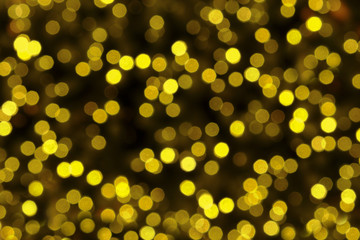 Abstract circularyellow light bokeh of the christmas tree.