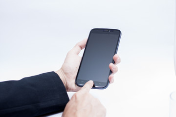 Obraz na płótnie Canvas Isolated male hands holding the Smartphone