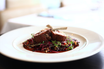 Lamb rack with pickled beetroot and black lentil ragout