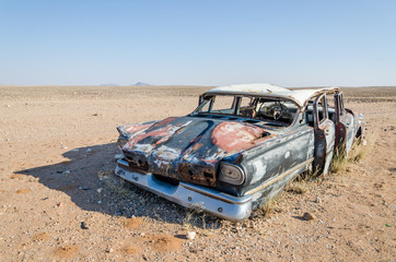 Wreck of classic saloon car abandoned deep in the Namib Desert of Angola