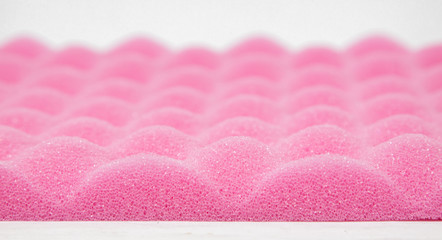 Sponge cushioning pink color on white background