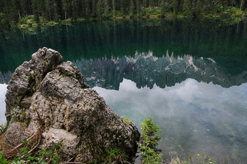 Reflection of the Dolomite Latemar Group in the Lake of Carezza (Karersee), Trentino Alto Adige, Italy.