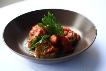 Sausage, baked red peppers, roman gnocchi and celery leaves