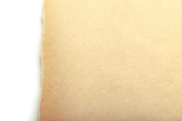 Brown package paper torn to reveal white panel