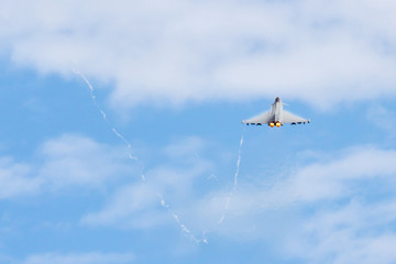 Fighter Jet flying away from camera