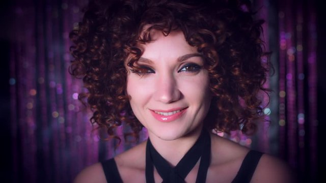 4k Disco Curly Sexy Woman Turns at Camera Smiling Happy