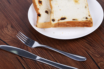 French toast on a white plate with  fork.