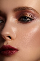 Close-up portrait of girl with bright red makeup