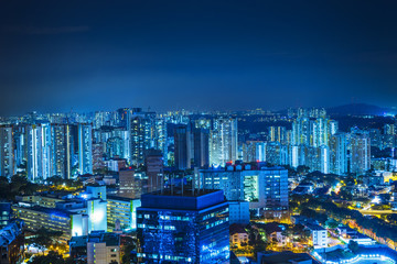 Naklejka premium Night cityscape of singapore with blue light filter - can use to display or montage on product