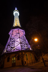 Petrin Lookout Tower in Prague at night.