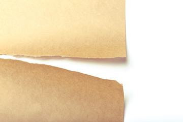 Brown package paper torn to reveal white panel