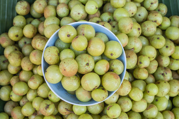 Local Thai green gooseberry fruit in Chiang Mai market, Thailand