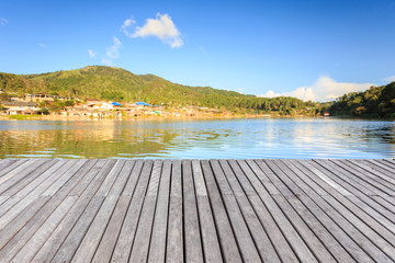 Empty wooden floor or decking beside the lake