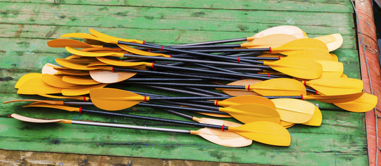 Kayak paddles on the dock closeup