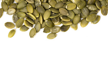 Pumpkin seeds on a white background.
