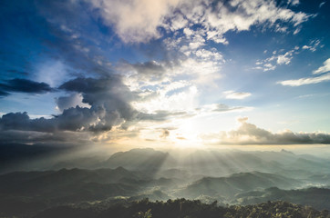 This image is landscape photo of sunlight on mountain with cloud