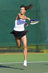 Tennis Player in mid air volley © Rapt.Tv