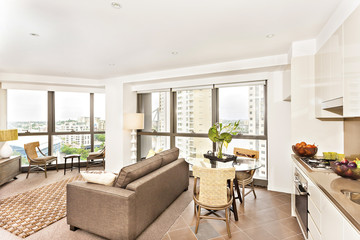 Modern room view near kitchen with sofa set.