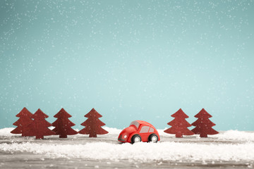 Vintage toy car in a winter landscape