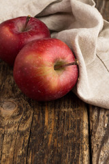 red apples on a wooden background