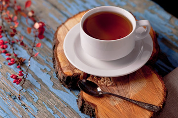 A cup of tea on a wooden background