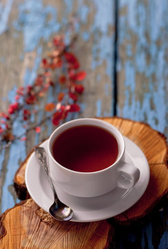 A cup of tea on a wooden background