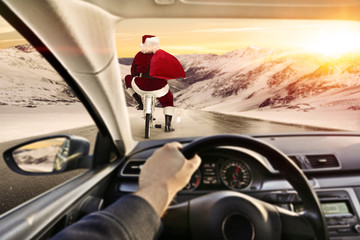 Fototapeta premium santa claus on bike and car interior 