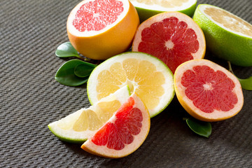 Citrus grapefruit set on a concrete gray background. The concept