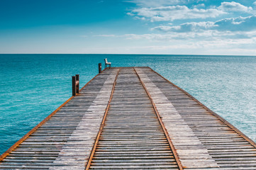 Obraz premium Tranquil landscape with pier on the sea
