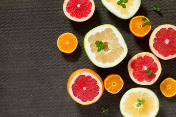 Citrus set of grapefruit and fresh mint on a concrete gray backg