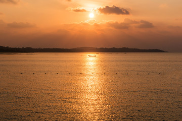 Sunset on th beach with boat