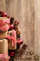 Christmas background with rustic gifts, snowflakes  and pine cones. top view with copy space