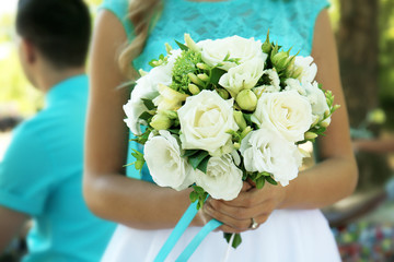 Bridesmaid holding beautiful bouquet of flowers, close up