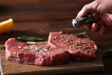 Butcher cooking pork meat on kitchen