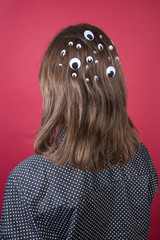 Back of head with toy eyes attached, artwork 